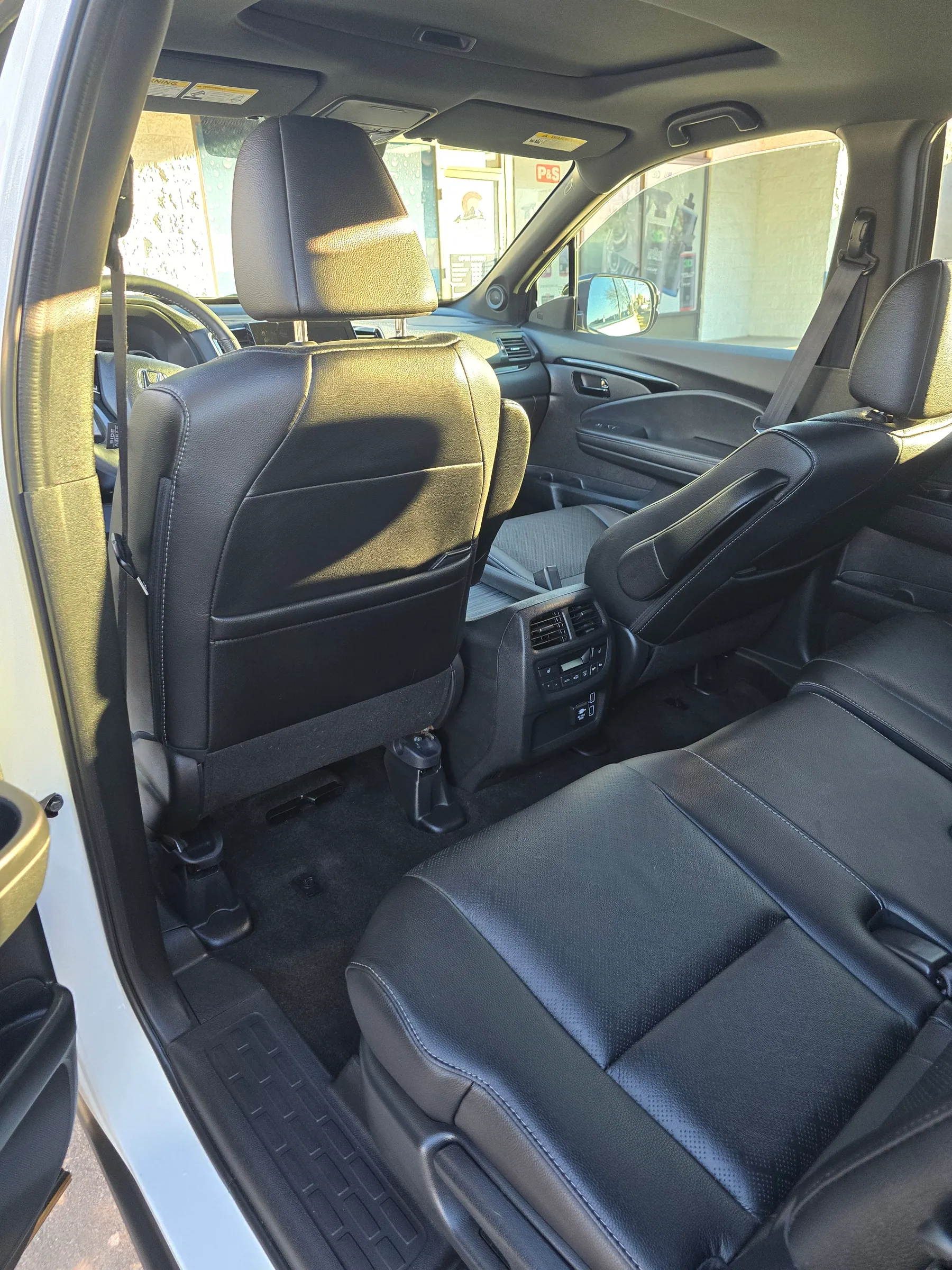 Dark leather seats and rear cabin of a vehicle